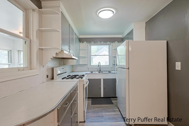 1966 Roilson St, Muskegon, MI 49441 - kitchen featuring white appliances, open shelves, under cabinet range hood, crown molding, and light countertops