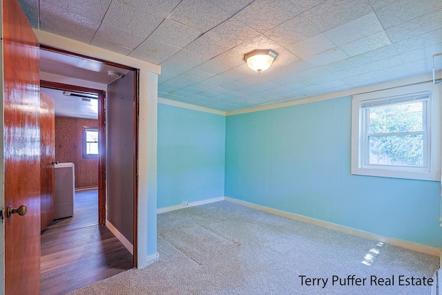 1966 Roilson St, Muskegon, MI 49441 - carpeted empty room featuring baseboards and crown molding