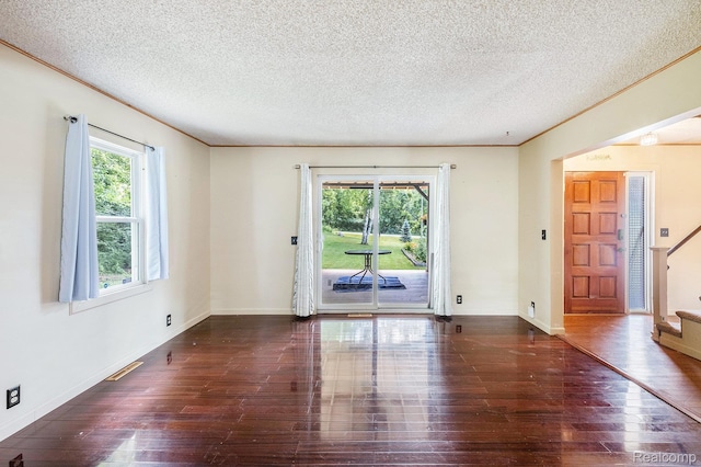3596 Hunt Rd, Lapeer, MI 48446 - empty room with wood-type flooring, stairs, and a textured ceiling