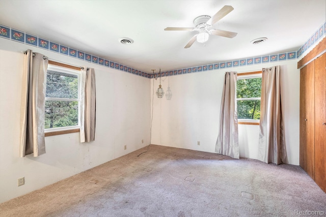 3596 Hunt Rd, Lapeer, MI 48446 - carpeted empty room featuring healthy amount of natural light and ceiling fan