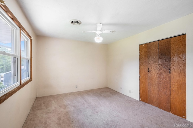 3596 Hunt Rd, Lapeer, MI 48446 - unfurnished bedroom with carpet floors, a closet, and ceiling fan