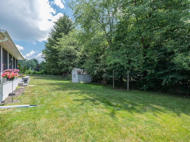 1627 Whitby Ave, Portage, MI 49024 - fenced backyard featuring a storage shed and view of scattered trees