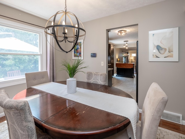 1627 Whitby Ave, Portage, MI 49024 - dining room featuring a chandelier and light wood-style floors