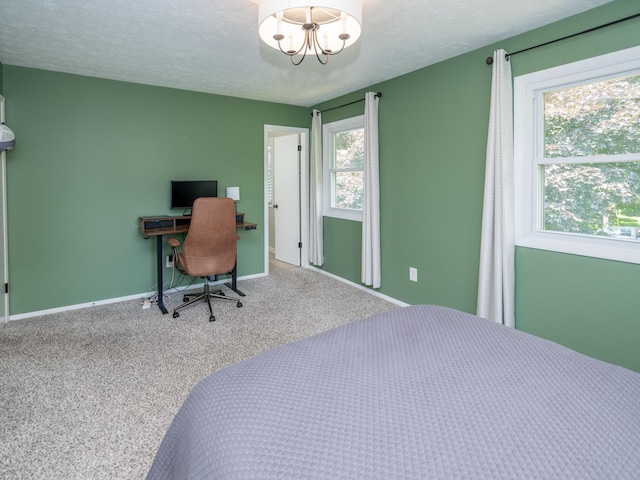 1627 Whitby Ave, Portage, MI 49024 - carpeted bedroom with an office area, a chandelier, and a textured ceiling