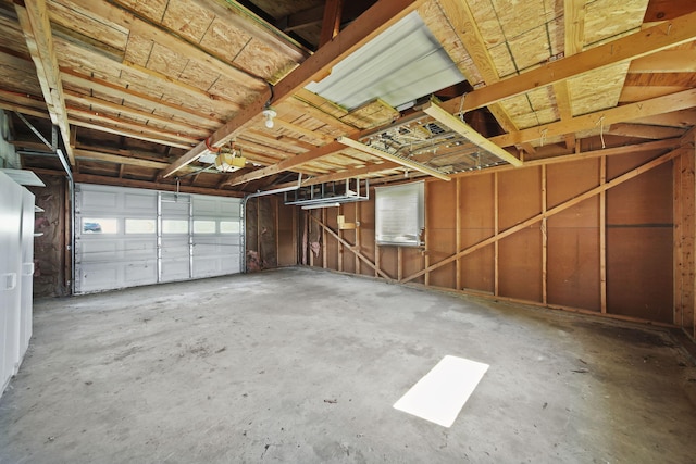 8020 Greenes Dr, Jackson, MI 49201 - garage featuring a garage door opener