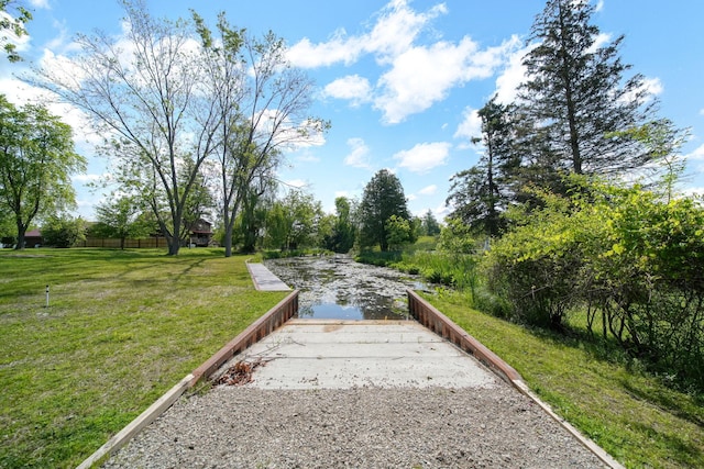 8020 Greenes Dr, Jackson, MI 49201 - view of home's community featuring a lawn and a boat ramp