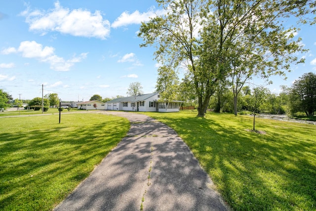 8020 Greenes Dr, Jackson, MI 49201 - surrounding community with a yard
