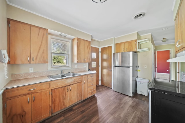 8020 Greenes Dr, Jackson, MI 49201 - kitchen with freestanding refrigerator, electric stove, dark wood-type flooring, light countertops, and crown molding
