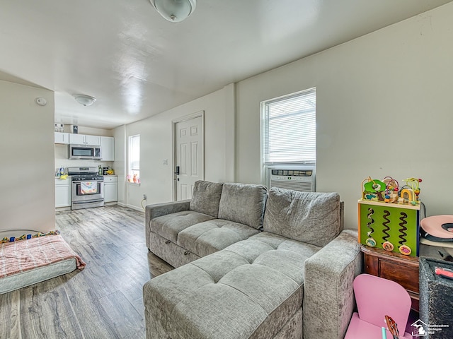 926 E Front St, Monroe, MI 48161 - living room featuring light wood-style floors and cooling unit