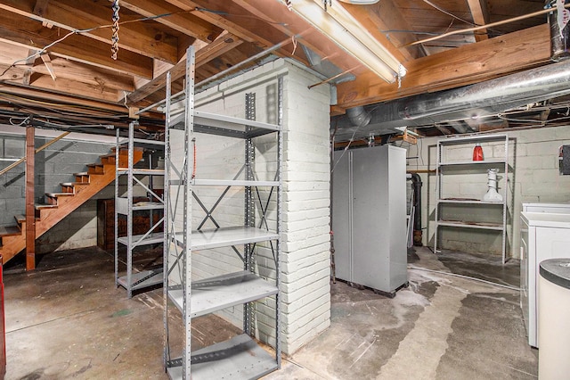 838 Lakeway Ave, Kalamazoo, MI 49001 - unfinished basement featuring washer / dryer, stairs, and concrete block wall