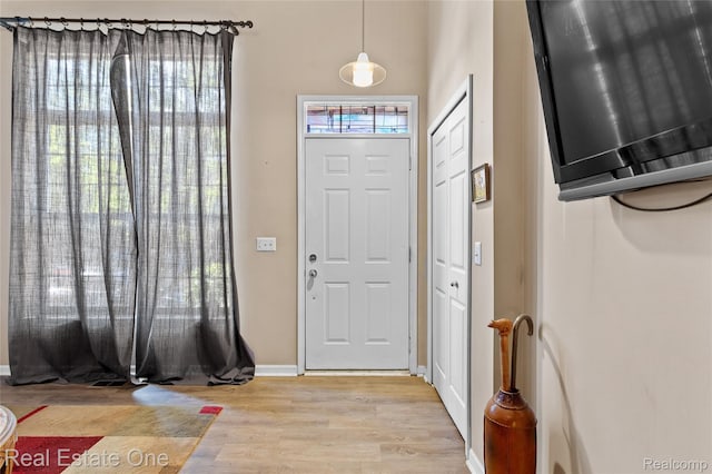 22145 W Village Dr, Dearborn, MI 48124 - foyer entrance with wood finished floors and baseboards