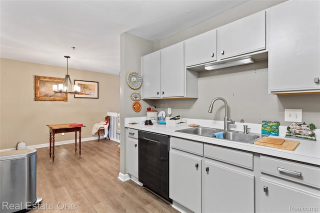 22145 W Village Dr, Dearborn, MI 48124 - kitchen featuring dishwasher, light countertops, a chandelier, light wood-type flooring, and pendant lighting