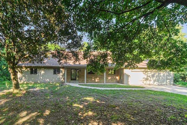 45745 County Road 652, Mattawan, MI 49071 - view of front of property with a garage, concrete driveway, and brick siding