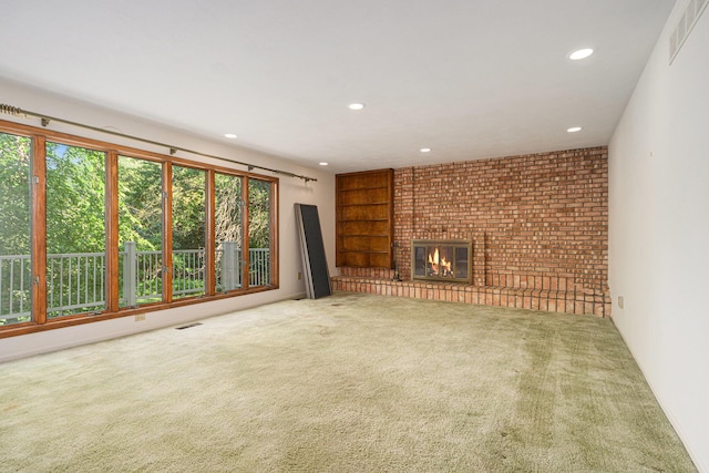 45745 County Road 652, Mattawan, MI 49071 - unfurnished living room featuring carpet flooring, recessed lighting, and a brick fireplace