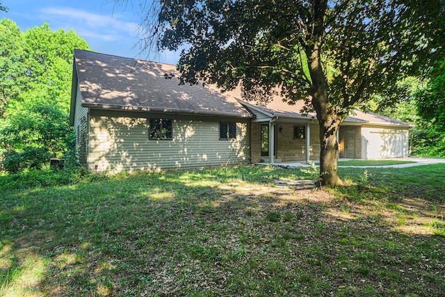 45745 County Road 652, Mattawan, MI 49071 - ranch-style home with an attached garage, a front lawn, and roof with shingles