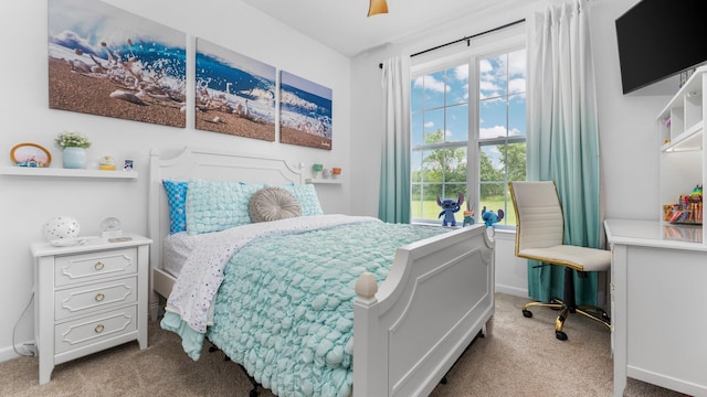 3850 Diuble Rd, Ann Arbor, MI 48103 - carpeted bedroom featuring baseboards and a ceiling fan