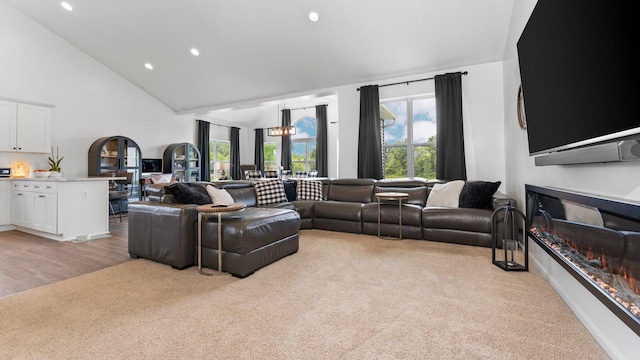 3850 Diuble Rd, Ann Arbor, MI 48103 - living area with recessed lighting, high vaulted ceiling, and light colored carpet