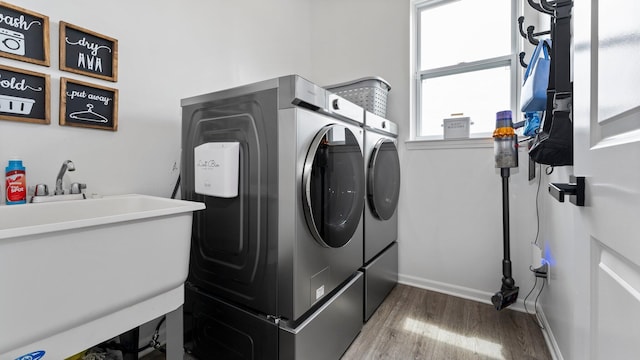 3850 Diuble Rd, Ann Arbor, MI 48103 - washroom with washer and clothes dryer and wood finished floors