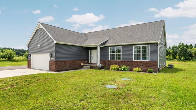 3850 Diuble Rd, Ann Arbor, MI 48103 - view of front of property featuring brick siding, concrete driveway, a front yard, and roof with shingles