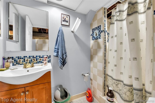 12876 Martin Rd, Warren, MI 48088 - bathroom featuring vanity, backsplash, and tile patterned floors