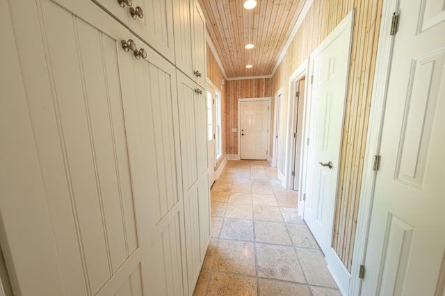 4569 N Ridge Rd, Mears, MI 49436 - corridor featuring recessed lighting, stone tile floors, and crown molding