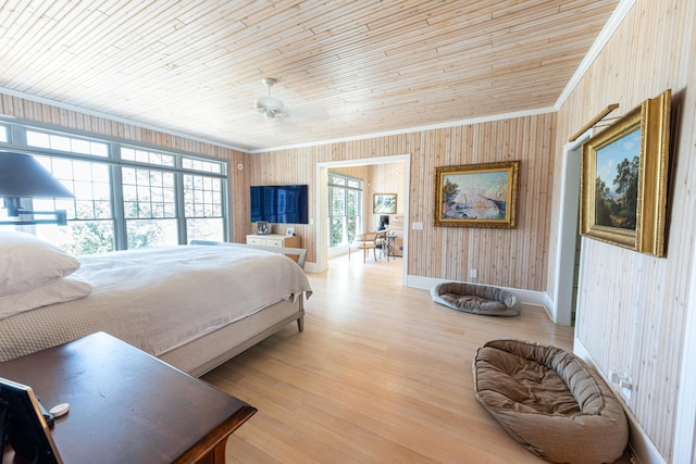 4569 N Ridge Rd, Mears, MI 49436 - bedroom with crown molding, wood walls, wooden ceiling, and light wood finished floors