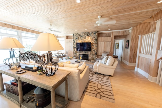 4569 N Ridge Rd, Mears, MI 49436 - living area featuring wood walls, wood ceiling, light wood-type flooring, and ceiling fan