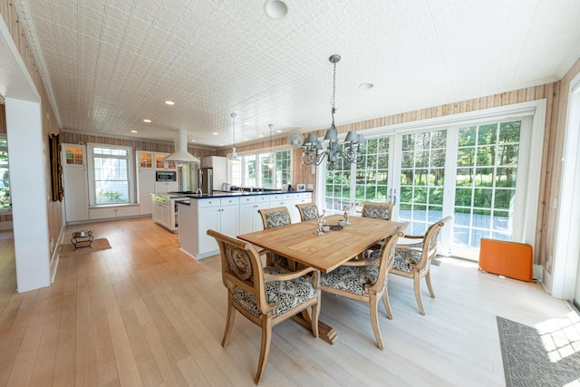 4569 N Ridge Rd, Mears, MI 49436 - dining space featuring a chandelier, light wood-style floors, and recessed lighting