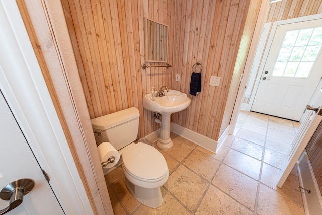 4569 N Ridge Rd, Mears, MI 49436 - half bathroom with toilet and wooden walls