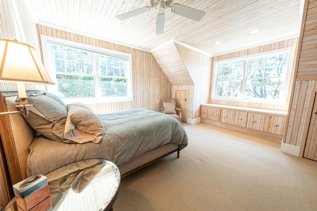 4569 N Ridge Rd, Mears, MI 49436 - carpeted bedroom with wood ceiling, multiple windows, wooden walls, lofted ceiling, and a ceiling fan