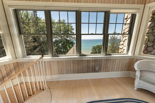 4569 N Ridge Rd, Mears, MI 49436 - unfurnished sunroom featuring a water view