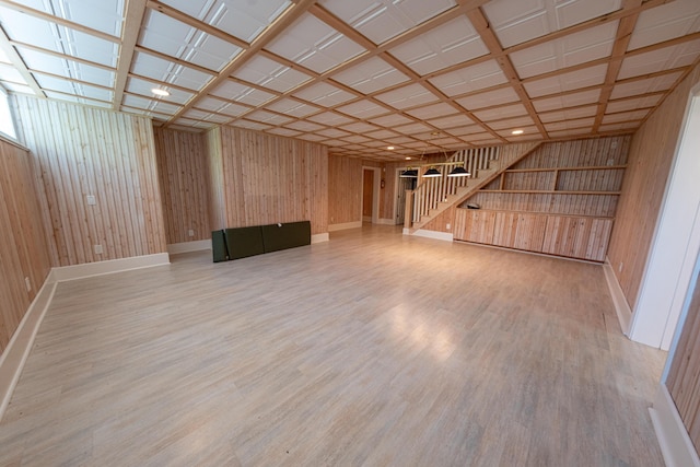 4569 N Ridge Rd, Mears, MI 49436 - finished below grade area featuring wood finished floors, stairway, and wood walls