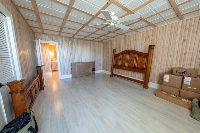 4569 N Ridge Rd, Mears, MI 49436 - bedroom with wood finished floors and wooden walls