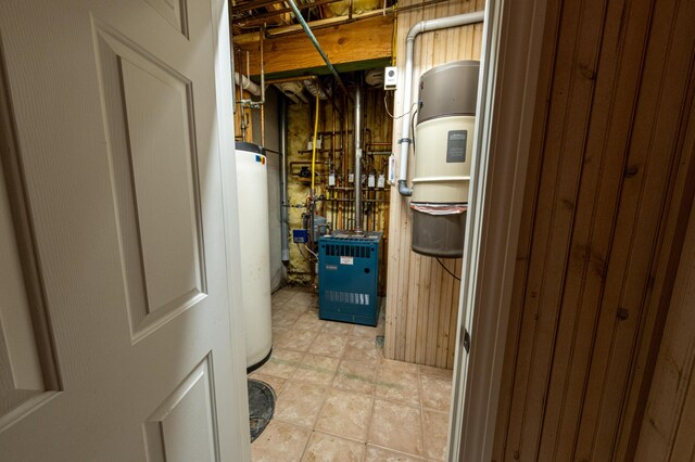 4569 N Ridge Rd, Mears, MI 49436 - utility room with water heater and a heating unit