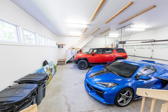 4569 N Ridge Rd, Mears, MI 49436 - garage featuring a garage door opener