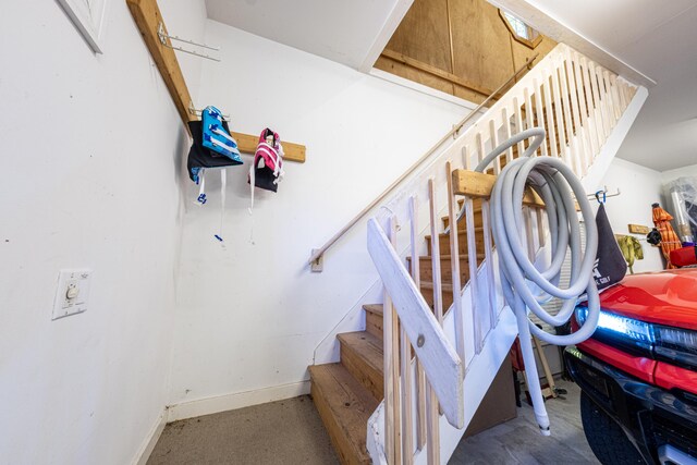 4569 N Ridge Rd, Mears, MI 49436 - staircase with baseboards