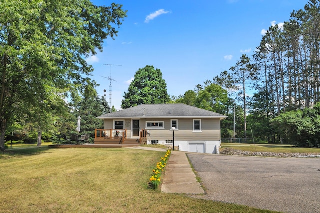 3914 135th Ave, Hersey, MI 49639 - view of front of property featuring a front lawn, a deck, driveway, and an attached garage