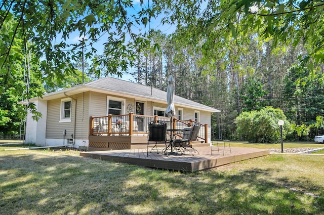 3914 135th Ave, Hersey, MI 49639 - back of property featuring a wooden deck and a lawn