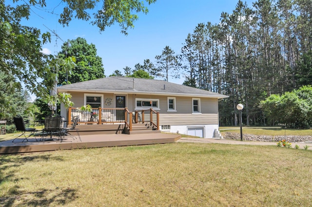 3914 135th Ave, Hersey, MI 49639 - back of property featuring a wooden deck, a yard, and an attached garage