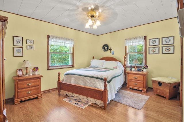 3914 135th Ave, Hersey, MI 49639 - bedroom with light wood-style floors and ceiling fan