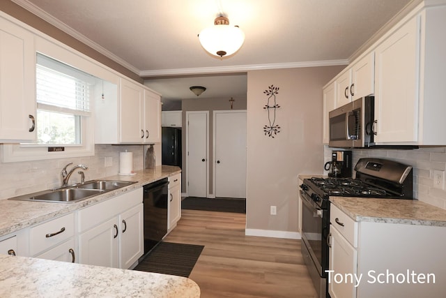 8179 Mellowwood Dr, Jenison, MI 49428 - kitchen featuring range with gas cooktop, stainless steel microwave, dishwasher, white cabinetry, and ornamental molding