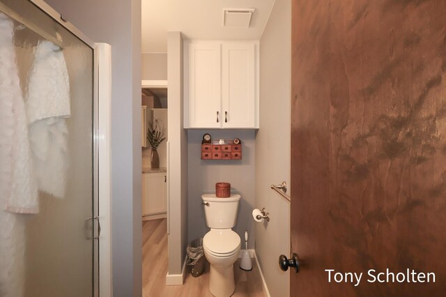 8179 Mellowwood Dr, Jenison, MI 49428 - bathroom featuring wood finished floors and a shower stall