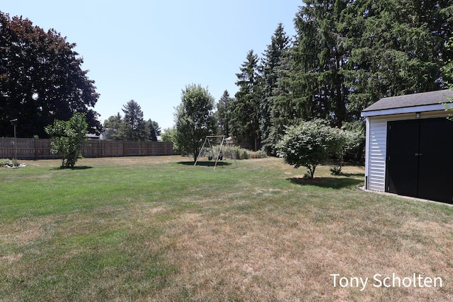8179 Mellowwood Dr, Jenison, MI 49428 - view of yard featuring a storage unit