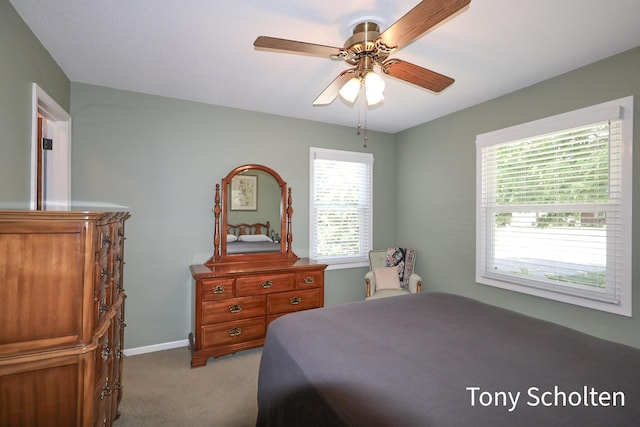 8179 Mellowwood Dr, Jenison, MI 49428 - bedroom with light colored carpet, multiple windows, and a ceiling fan