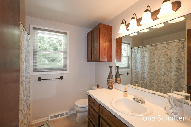 8179 Mellowwood Dr, Jenison, MI 49428 - bathroom featuring healthy amount of natural light, vanity, and tile patterned flooring