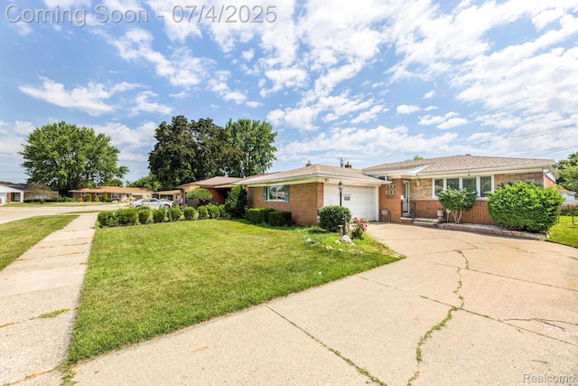 8571 Linda St, Warren, MI 48093 - view of front of property featuring brick siding, driveway, a garage, and a front lawn