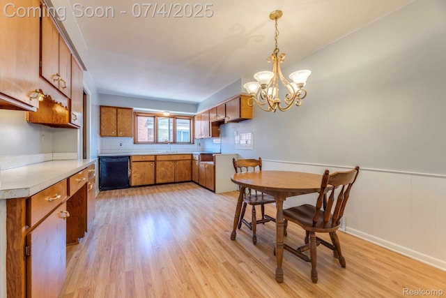 8571 Linda St, Warren, MI 48093 - kitchen with dishwasher, brown cabinets, light wood-style flooring, a chandelier, and hanging light fixtures