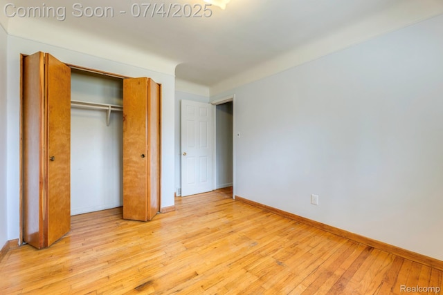 8571 Linda St, Warren, MI 48093 - unfurnished bedroom with light wood-style flooring and a closet