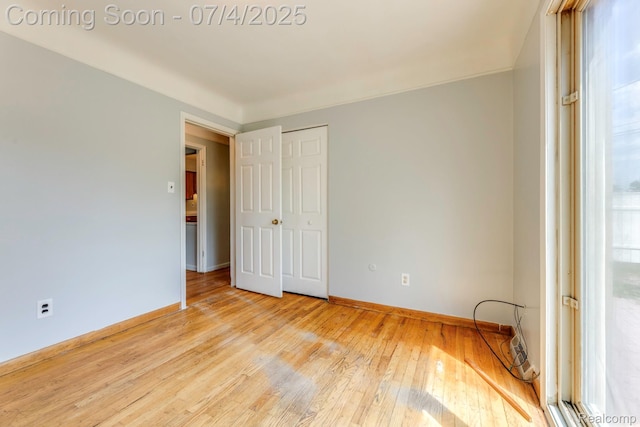 8571 Linda St, Warren, MI 48093 - spare room featuring baseboards and wood-type flooring