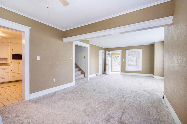 240 Stillwell Ave, Michigan Center, MI 49254 - unfurnished room with light colored carpet, stairway, ornamental molding, a ceiling fan, and a textured wall